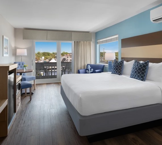 a room with a bed and a television