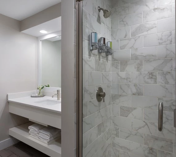 a bathroom with a shower and sink