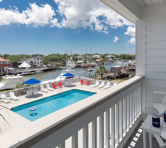 a pool on a balcony overlooking a marina