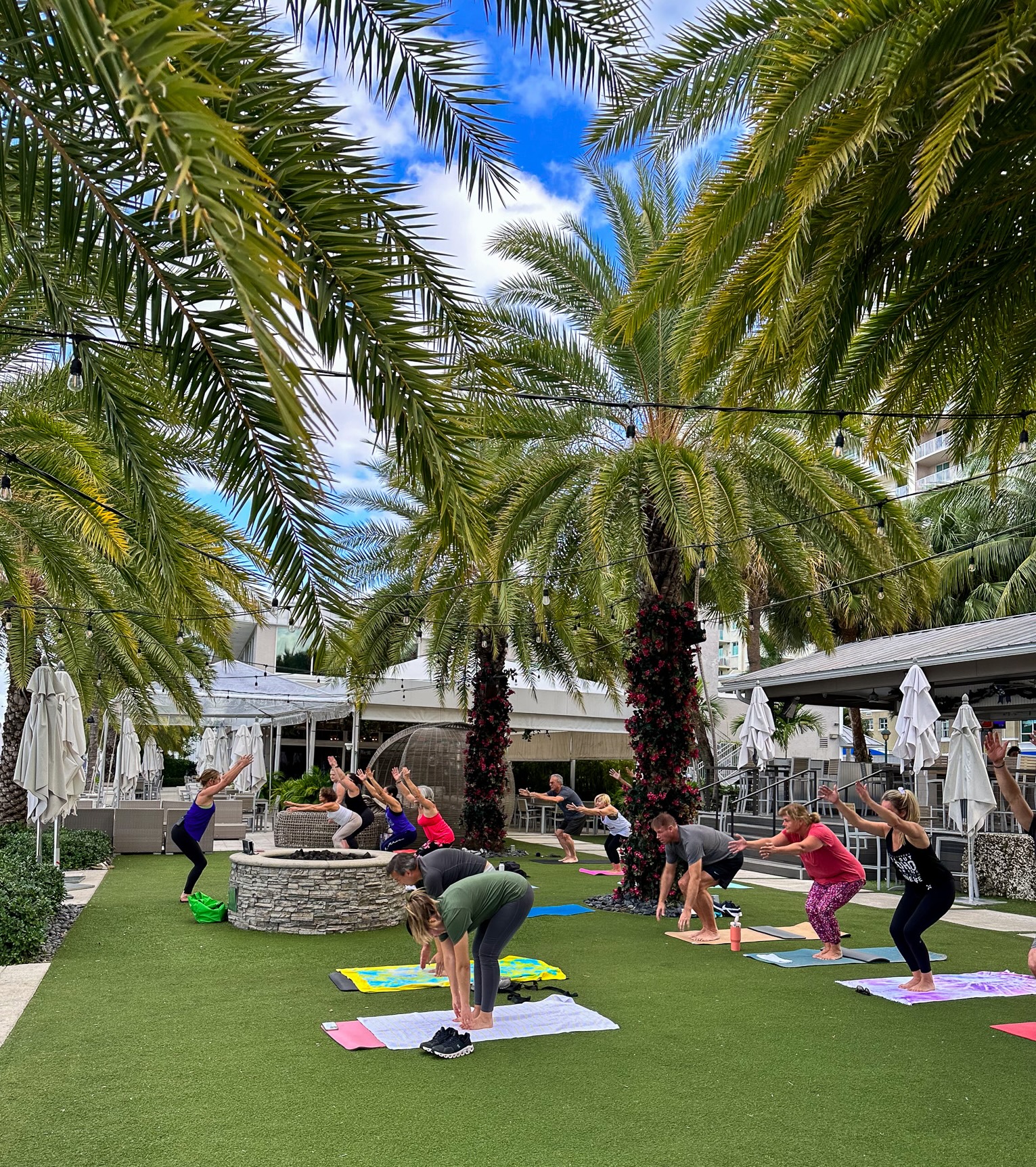 a group of people doing yoga outside
