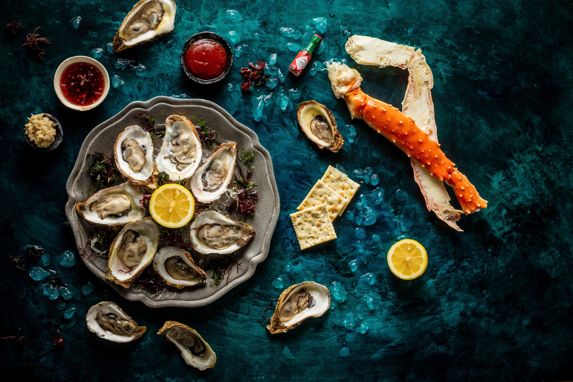 a plate of oysters and crab legs
