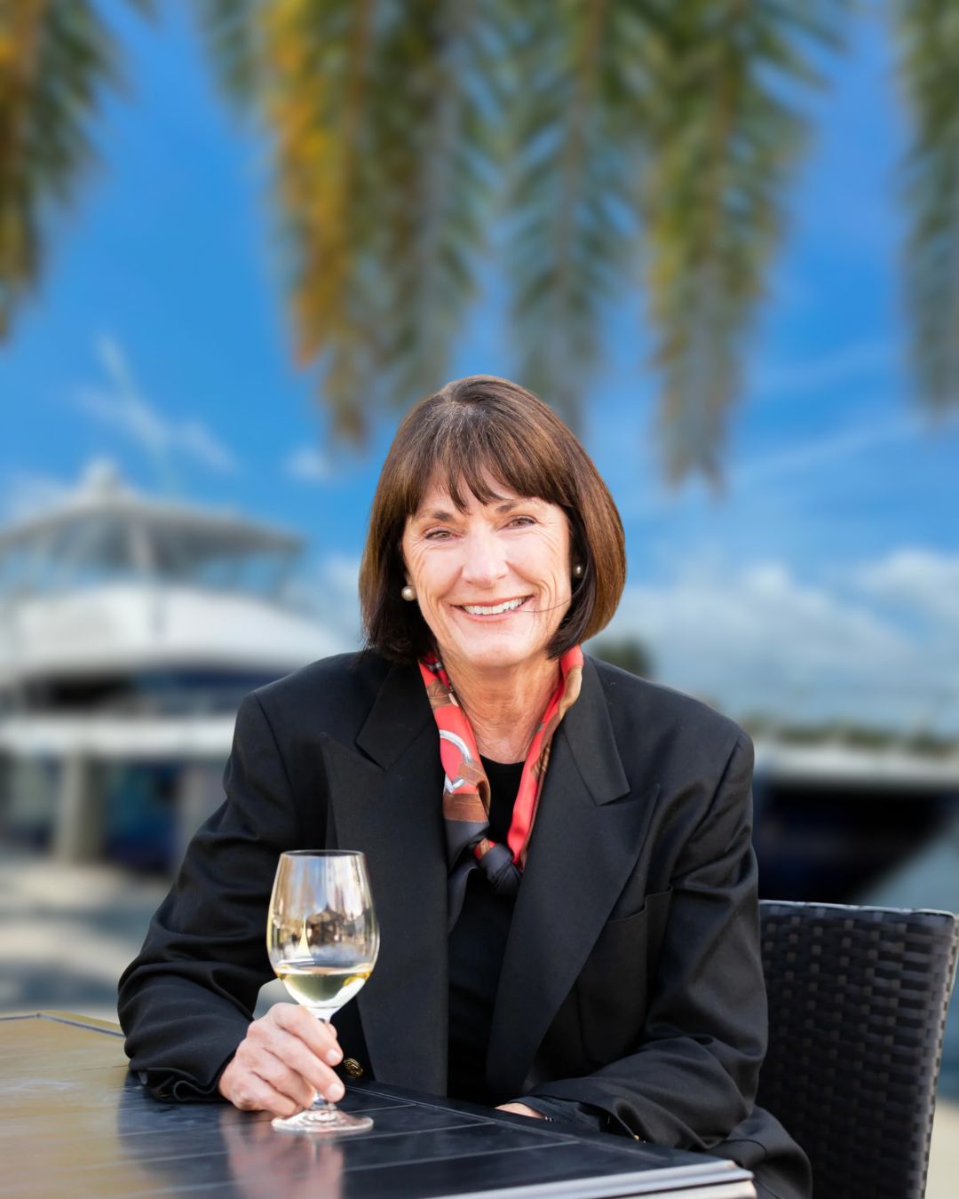 a woman holding a glass of wine
