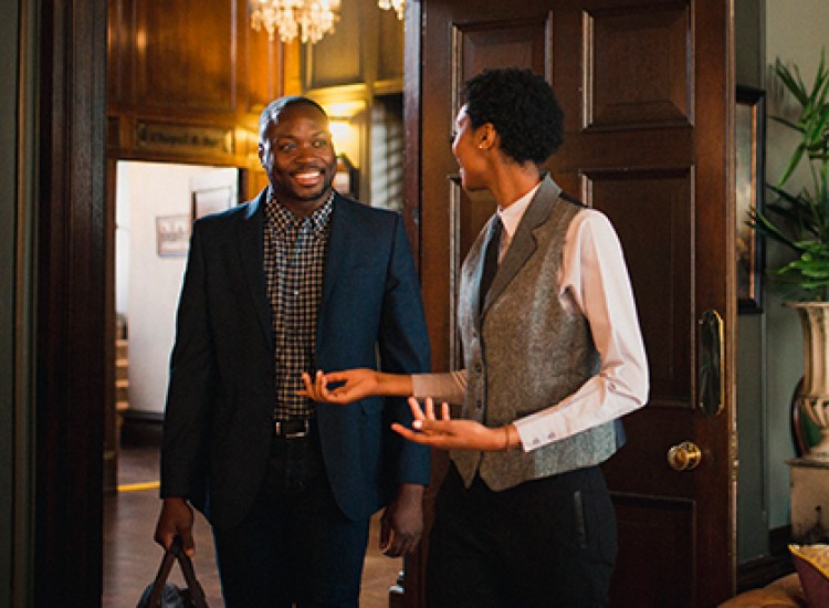 Receptionist greeting guest