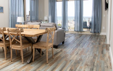 a living room with a table and chairs