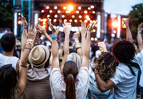 a group of people with their hands up