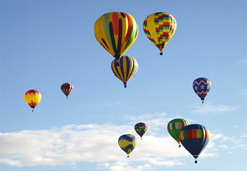 a group of hot air balloons in the sky