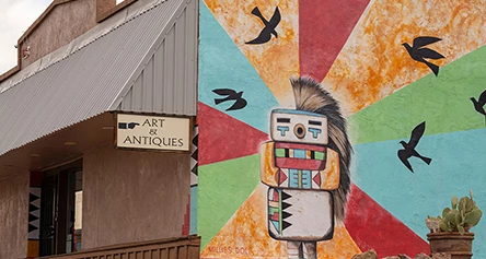 a mural of a robot and birds