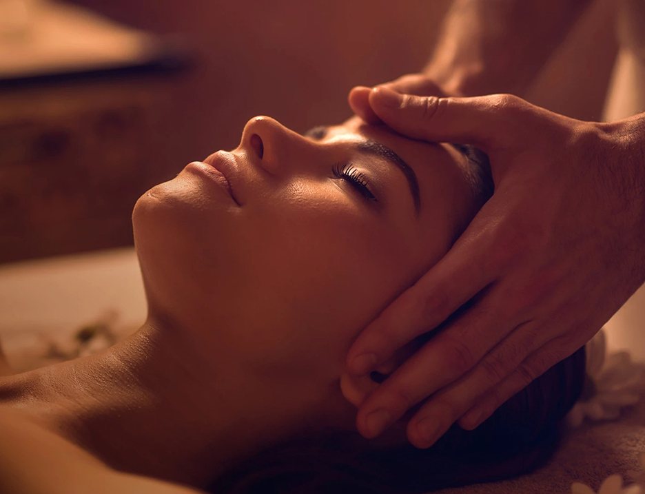 a woman receiving a face massage