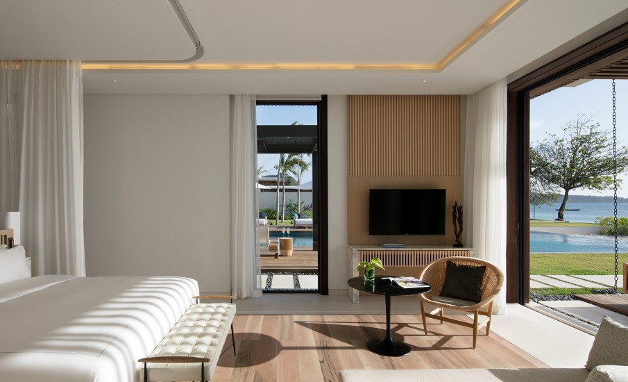 A villa bedroom illuminated by natural sunlight at Silversands Grand Anse.