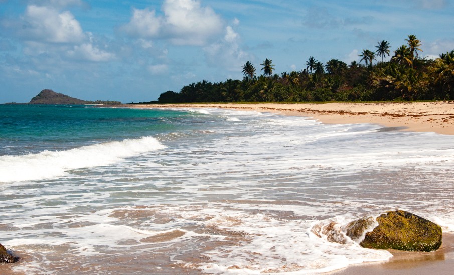 a beach with waves crashing on it