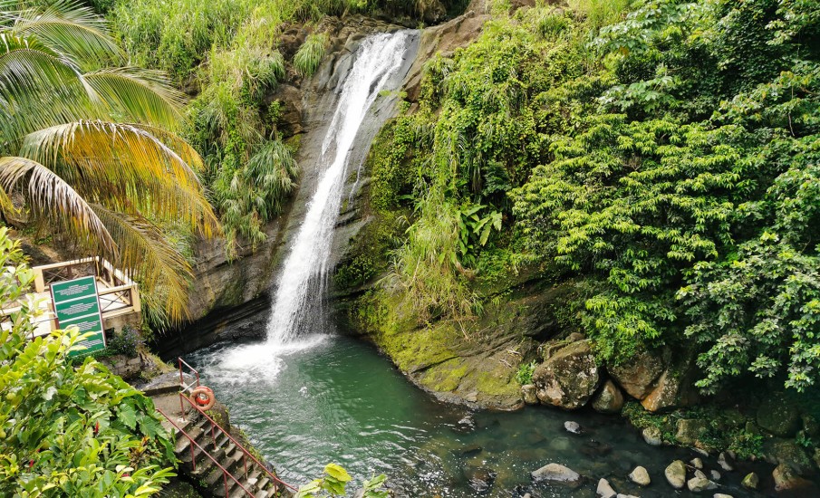 a waterfall over a bridge