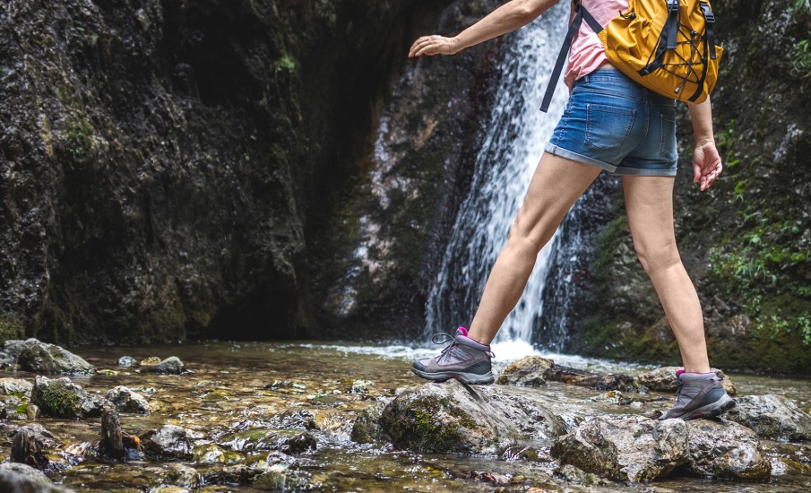 a man walking on a rocky path