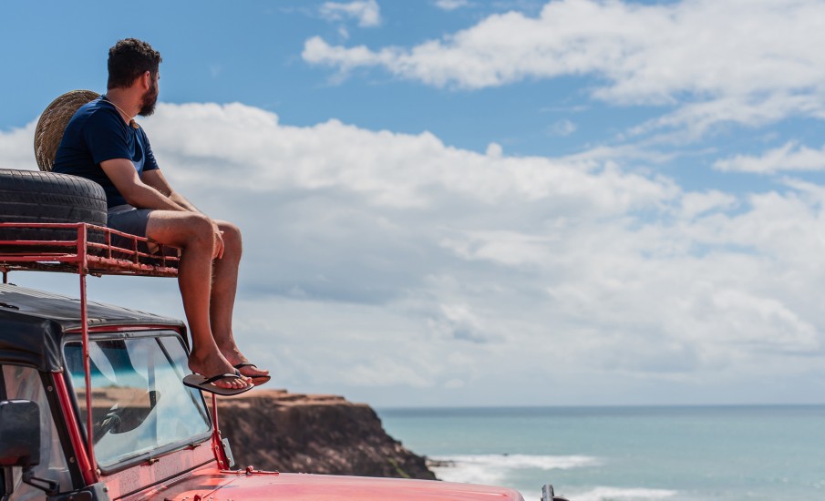 a man sitting on a car