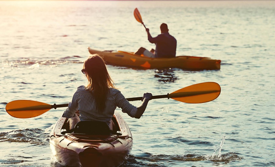 a man and woman in kayaks