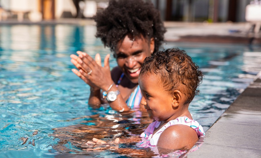 a man and a child in a pool