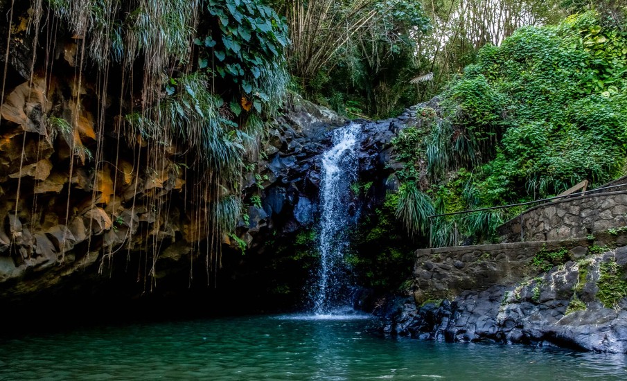 a waterfall over a rocky cliff