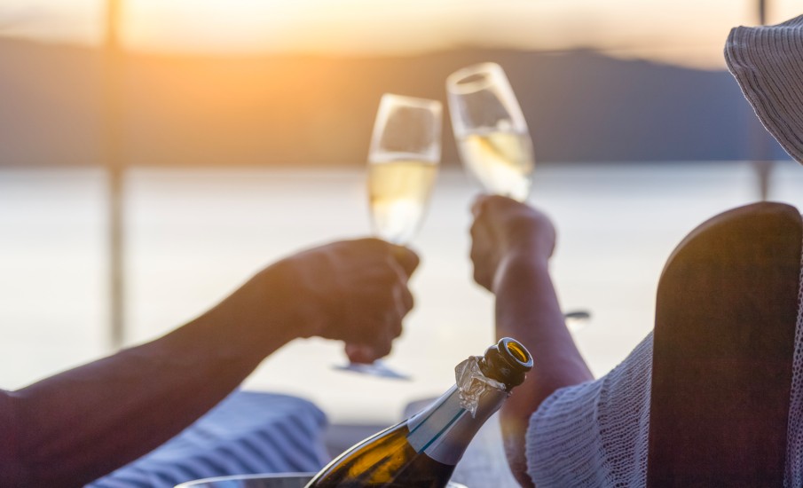 a group of people holding glasses of wine