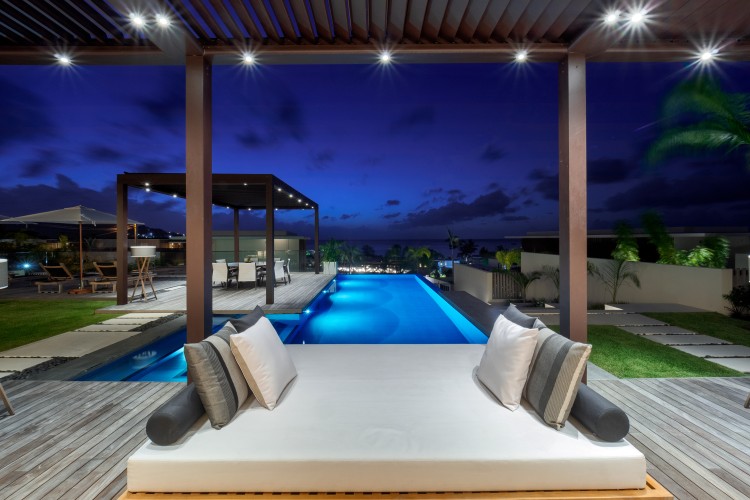 a pool with a deck and a deck with a deck and a pool