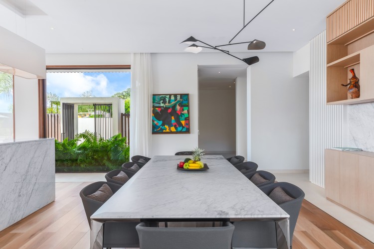 a dining table with chairs in a room