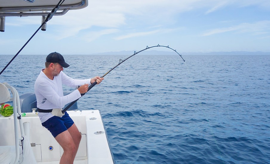 a person fishing on a boat