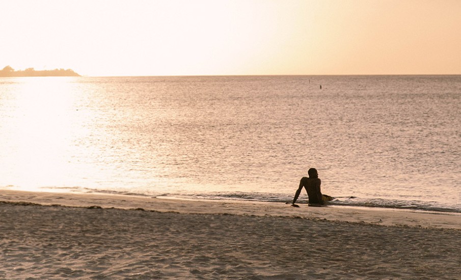 a person sitting on a beach