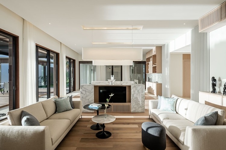 A villa living room with two sofas and a televison at Silversands Grand Anse.