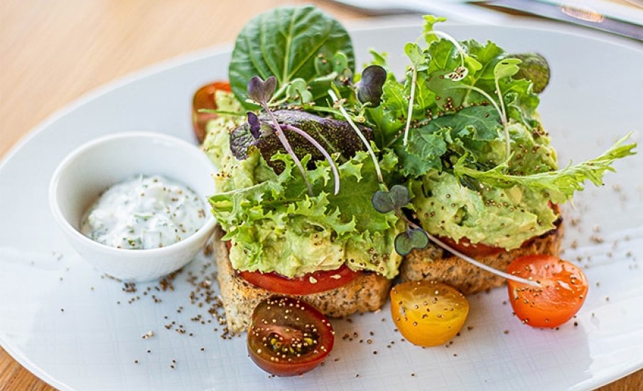 Mashed avocado, lettuce and tomatoes on toast served at the Beach Lounge in Grand Anse Grenada.