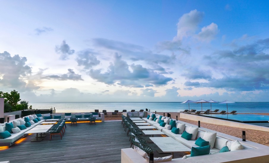 Exterior of the Beach Lounge tabels and lounge chairs during sunset at Grand Anse Beach.