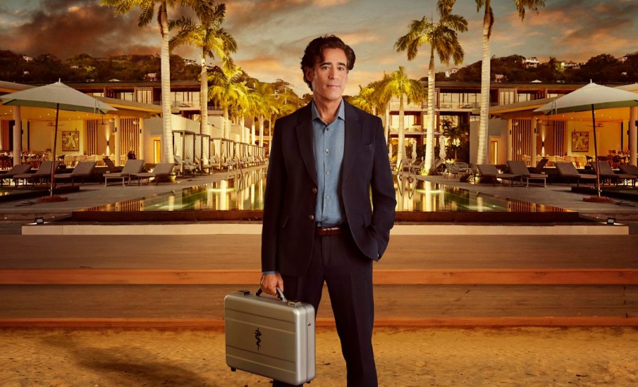a man holding a briefcase in front of a pool