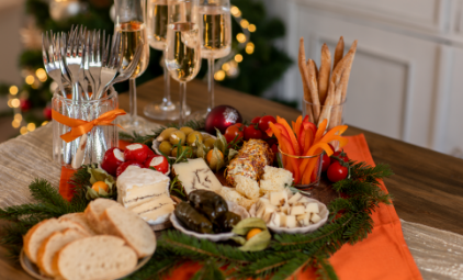 a table with food and glasses of champagne