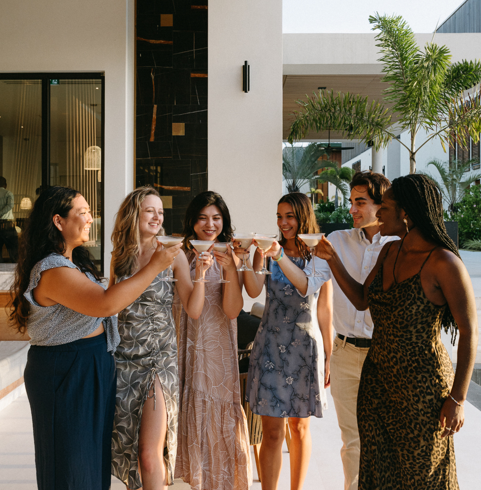 a group of people holding drinks
