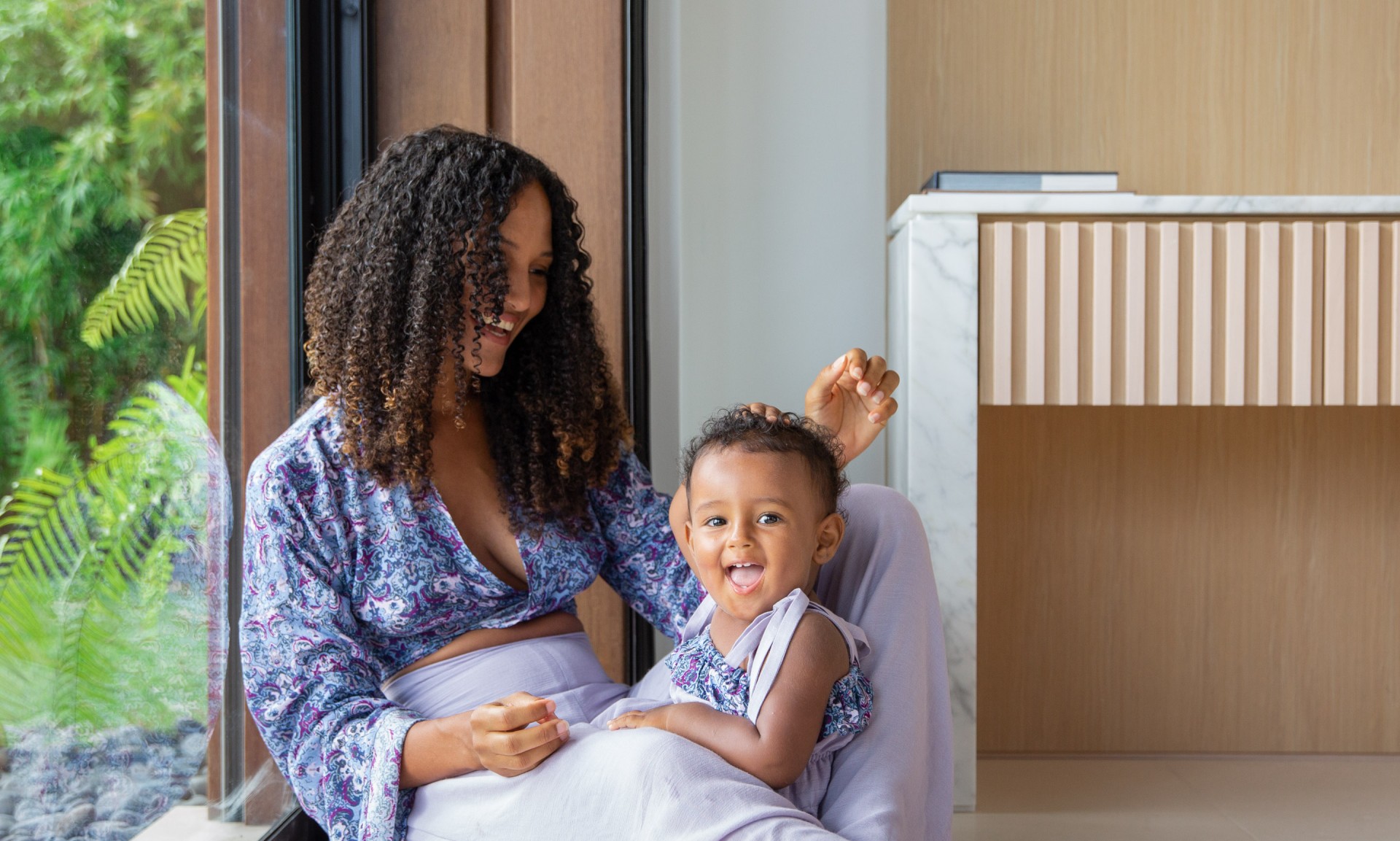 a woman holding a baby