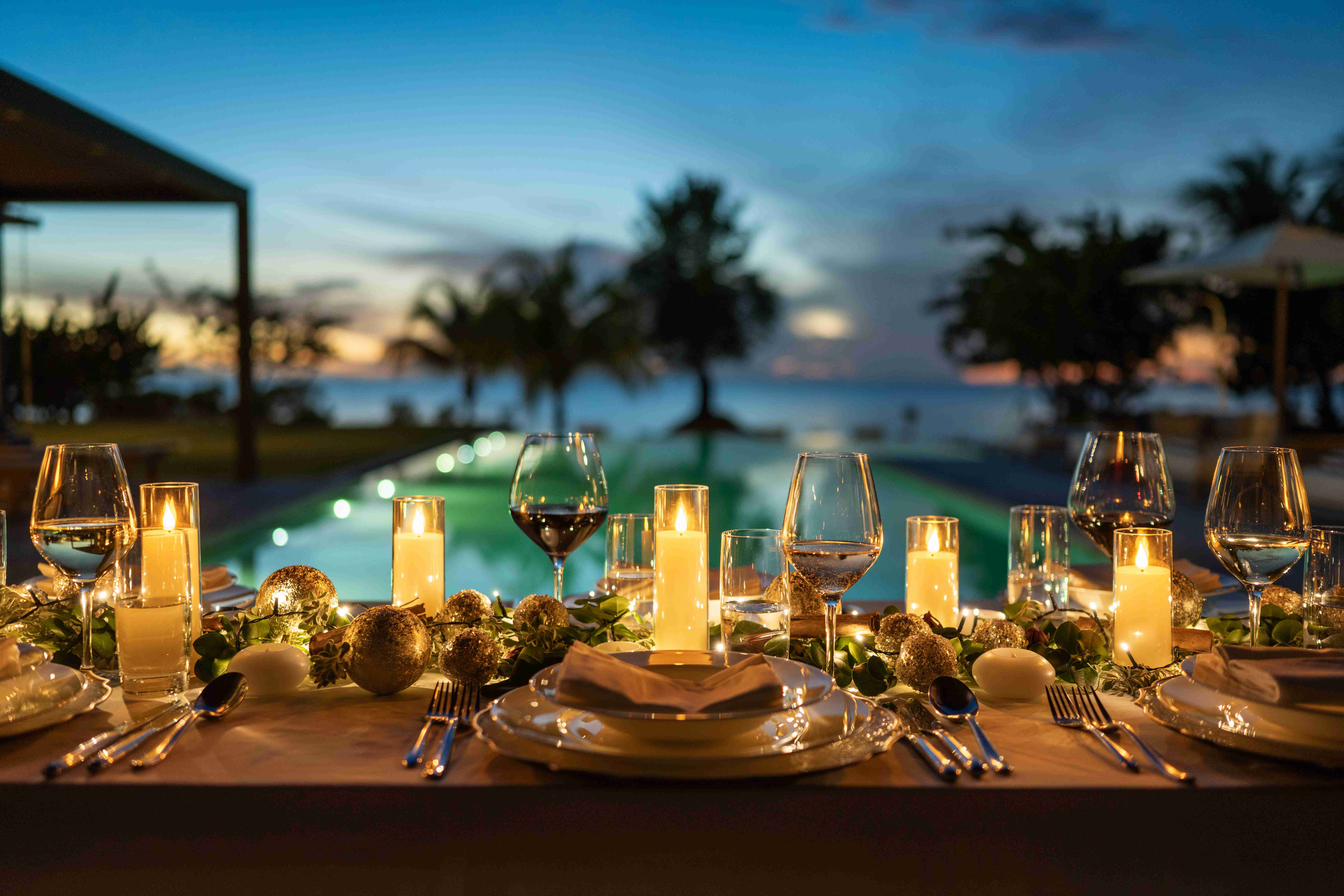 a table with candles and glasses on it