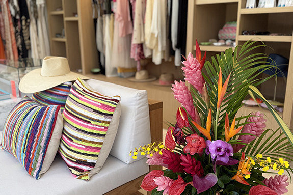 a room with a couch and a flower arrangement