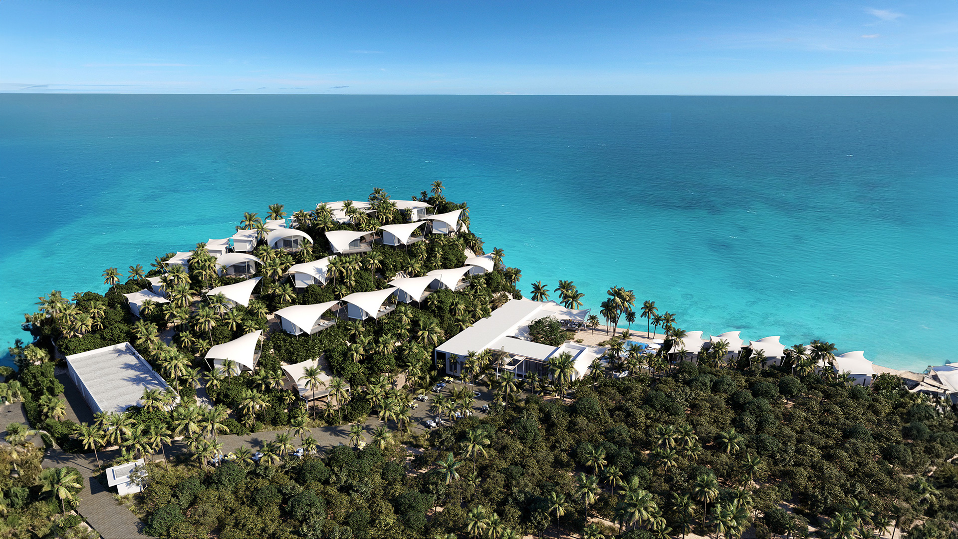 a group of houses on a hill by the ocean