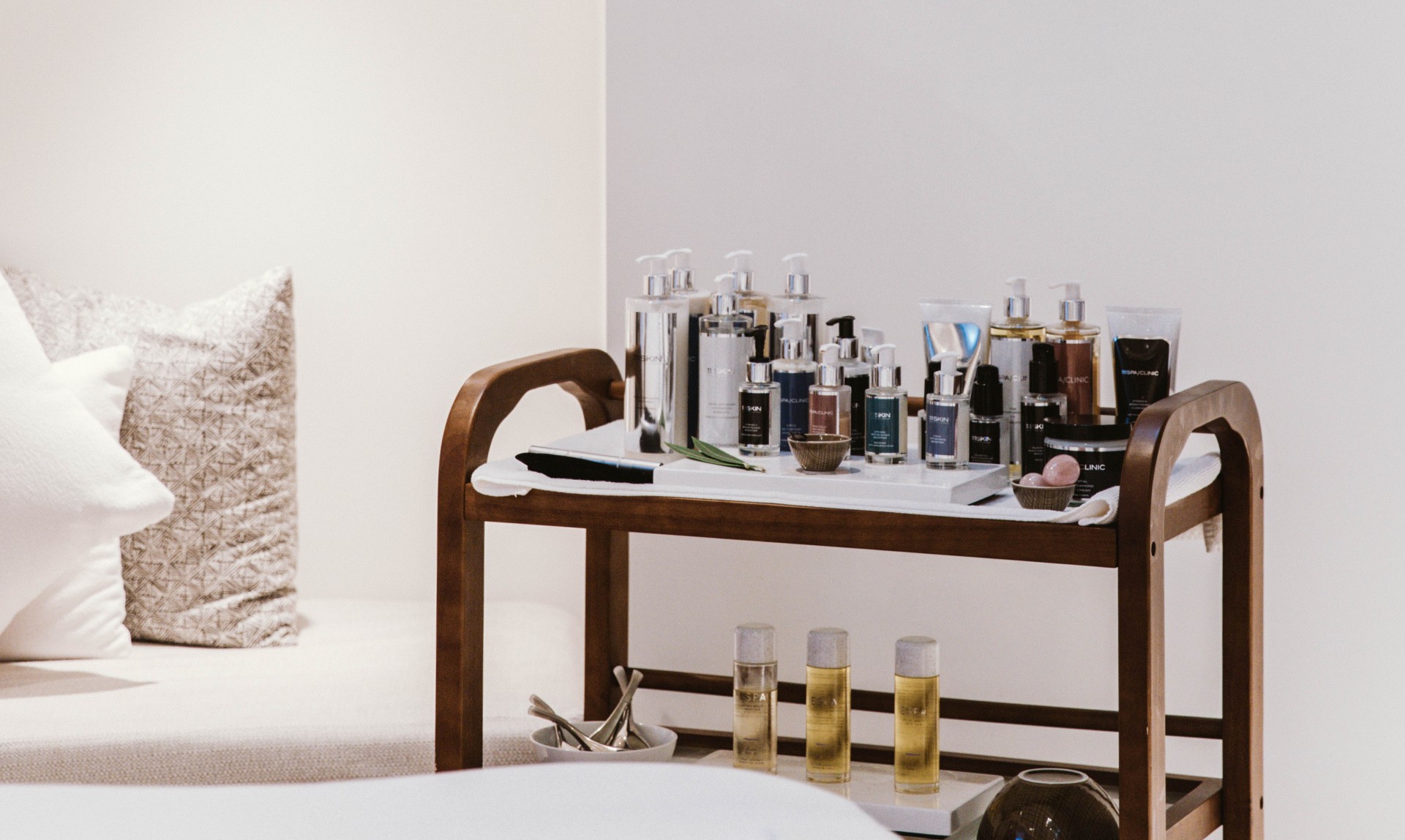 a table with a group of bottles of cosmetics on it