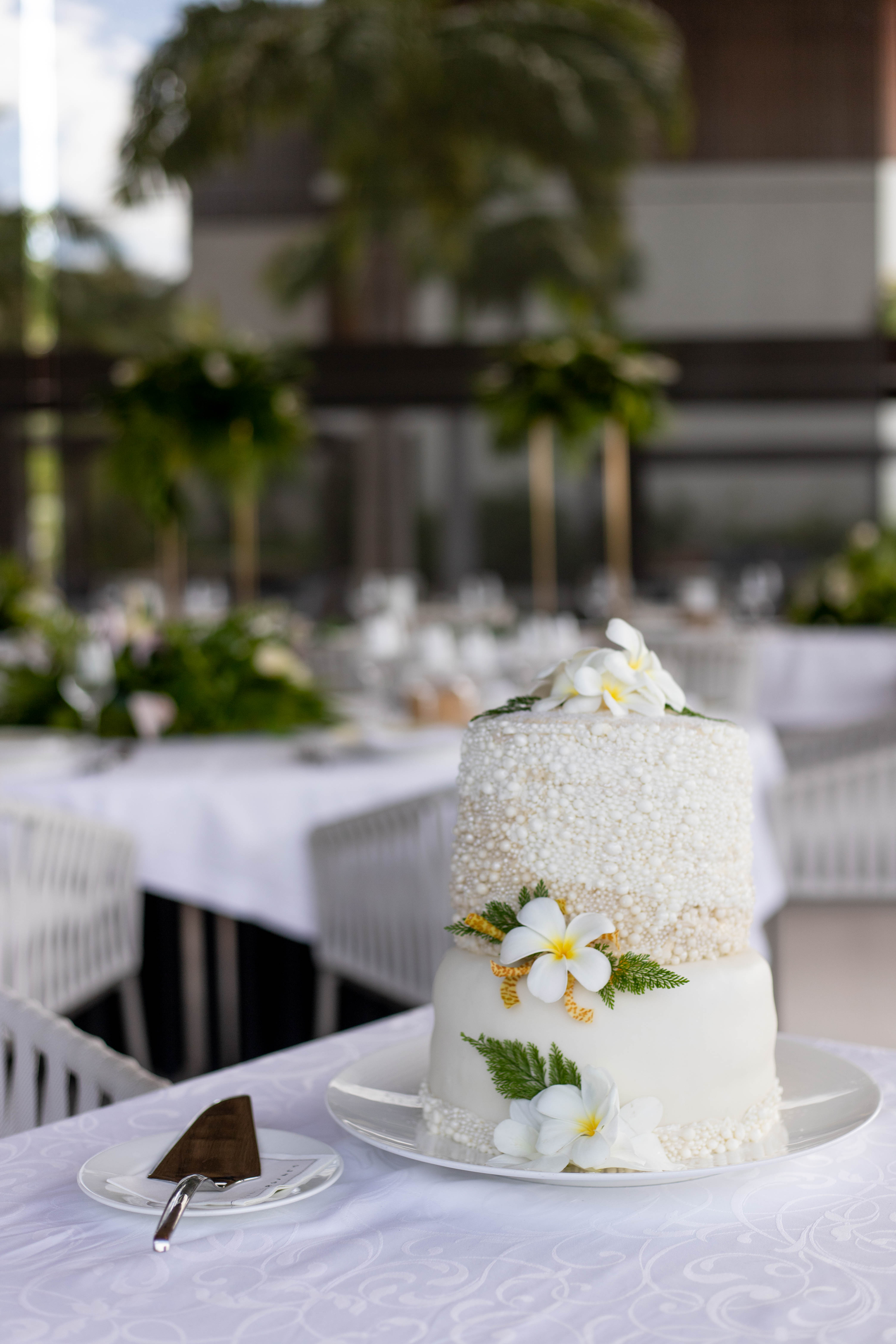 a white cake with flowers on it