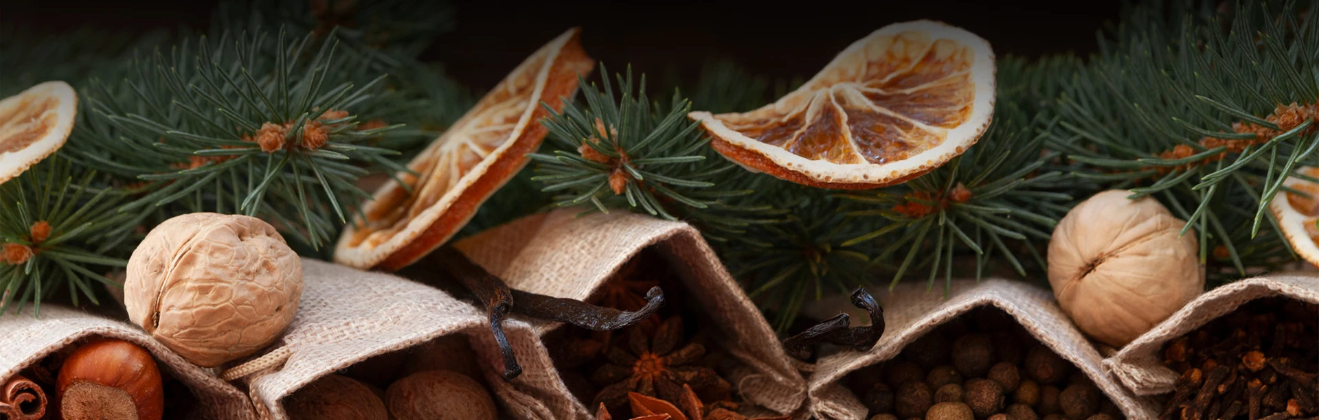dried orange slices and spices in burlap bags