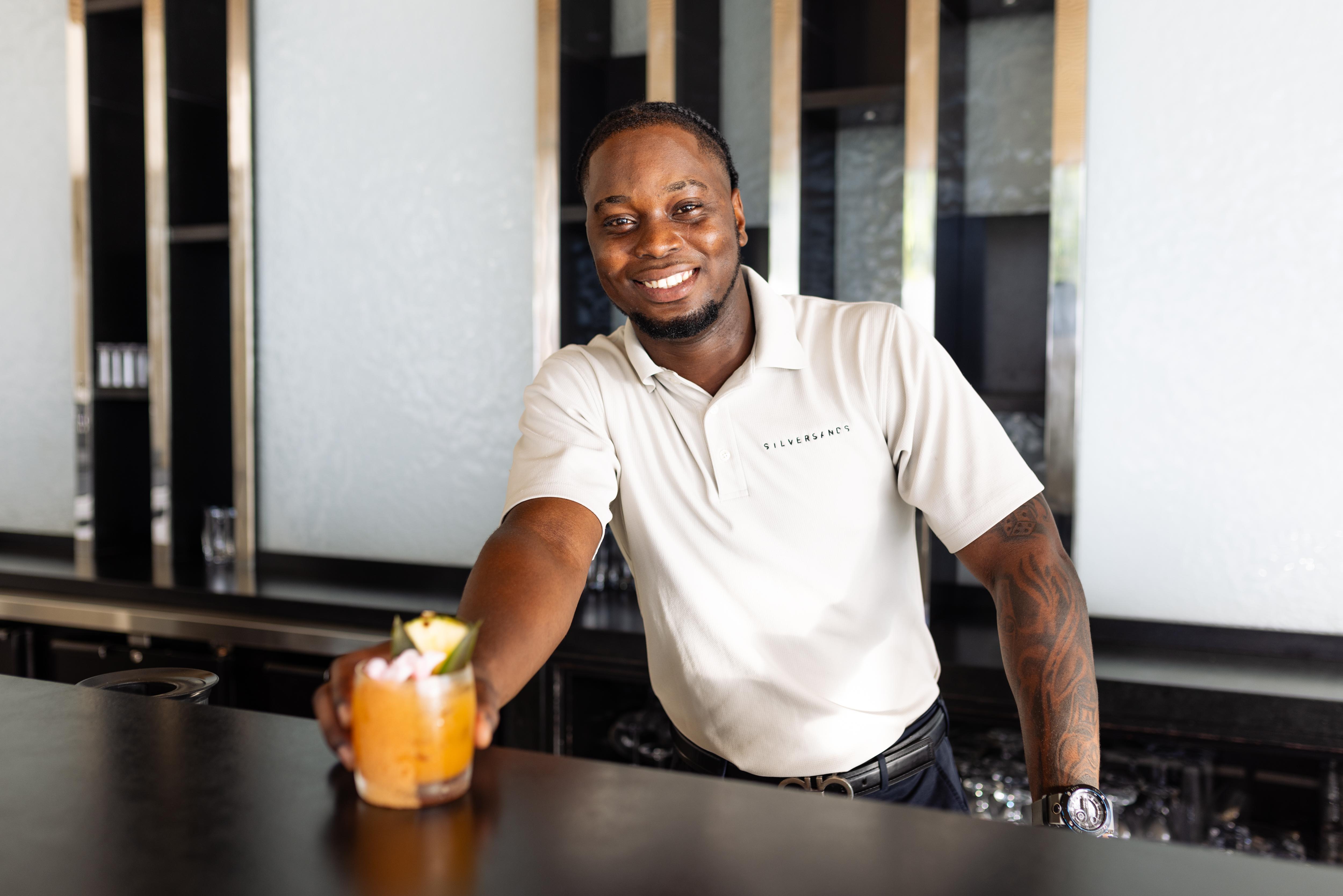 a man holding a drink