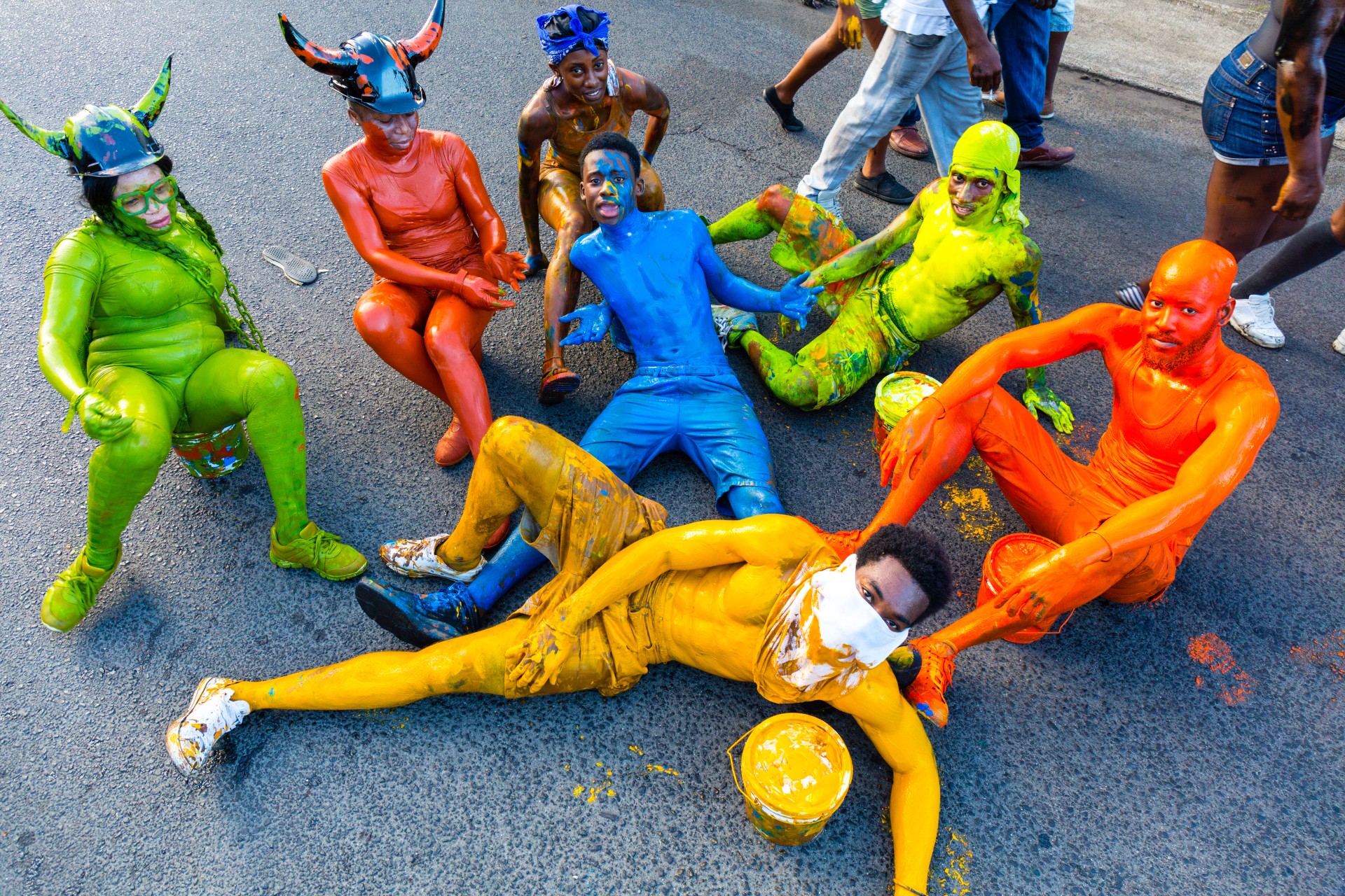 a group of people in colorful body paint
