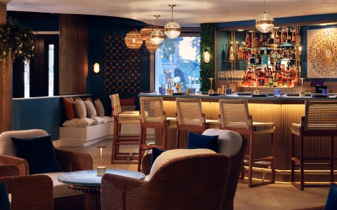 a bar with chairs and tables