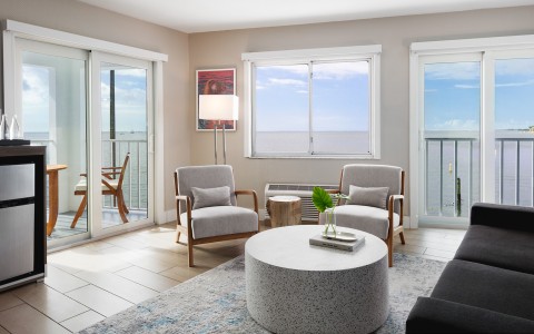a living room with a table and chairs