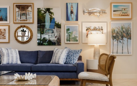a living room with a couch and pictures on the wall