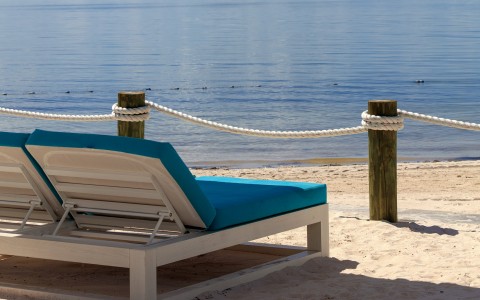 a beach chair on a sandy beach