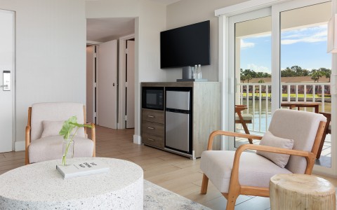 a living room with a television and a table