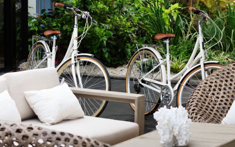 two bicycles next to a couch
