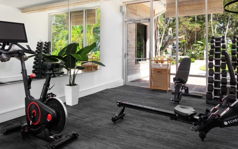 a room with exercise bikes and exercise equipment