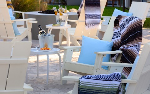 chairs and a table on a beach