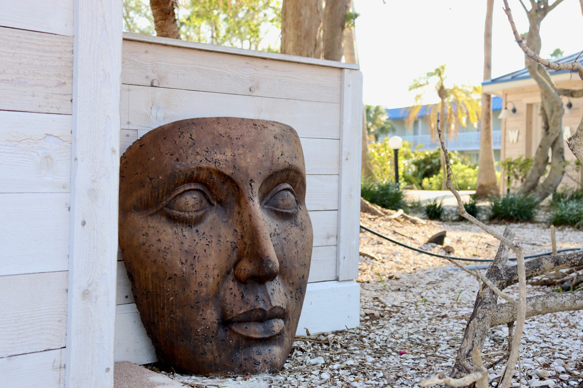 a sculpture of a face on a wall