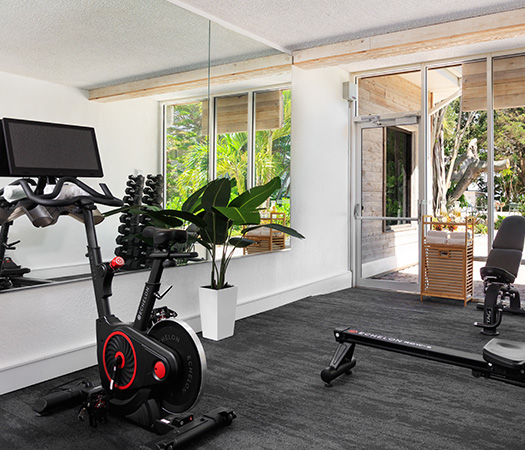 a room with exercise bikes and a computer